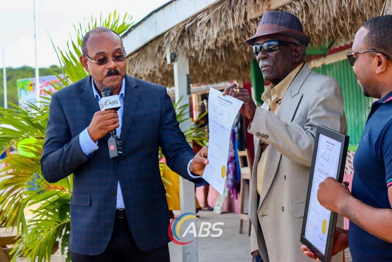 Government presents Title to beachfront land to local Calypso Icon